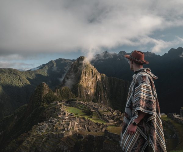 vertical-shot-of-a-caucasian-hiker-overlooking-mac-2023-11-27-05-10-22-utc-min